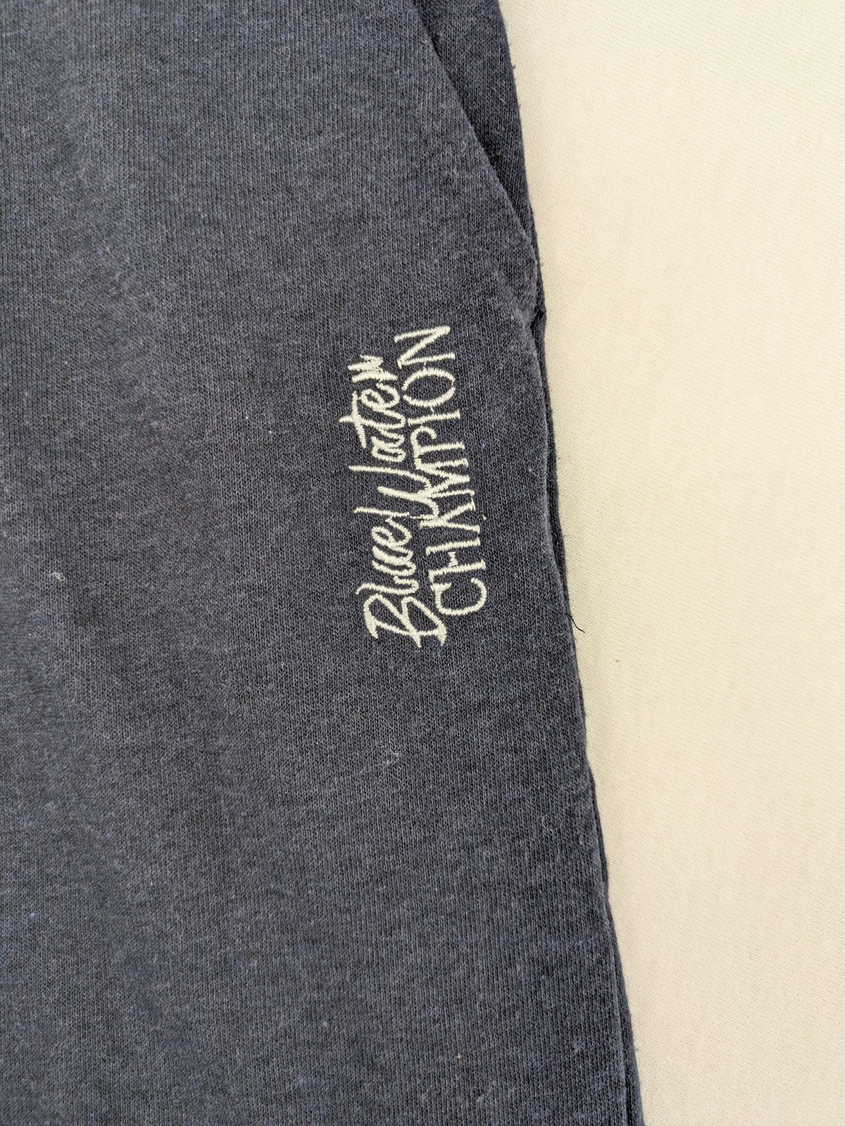 Livergy blue sweatshorts with embroidered "Blue Water Champion" logo and adjustable drawstring.