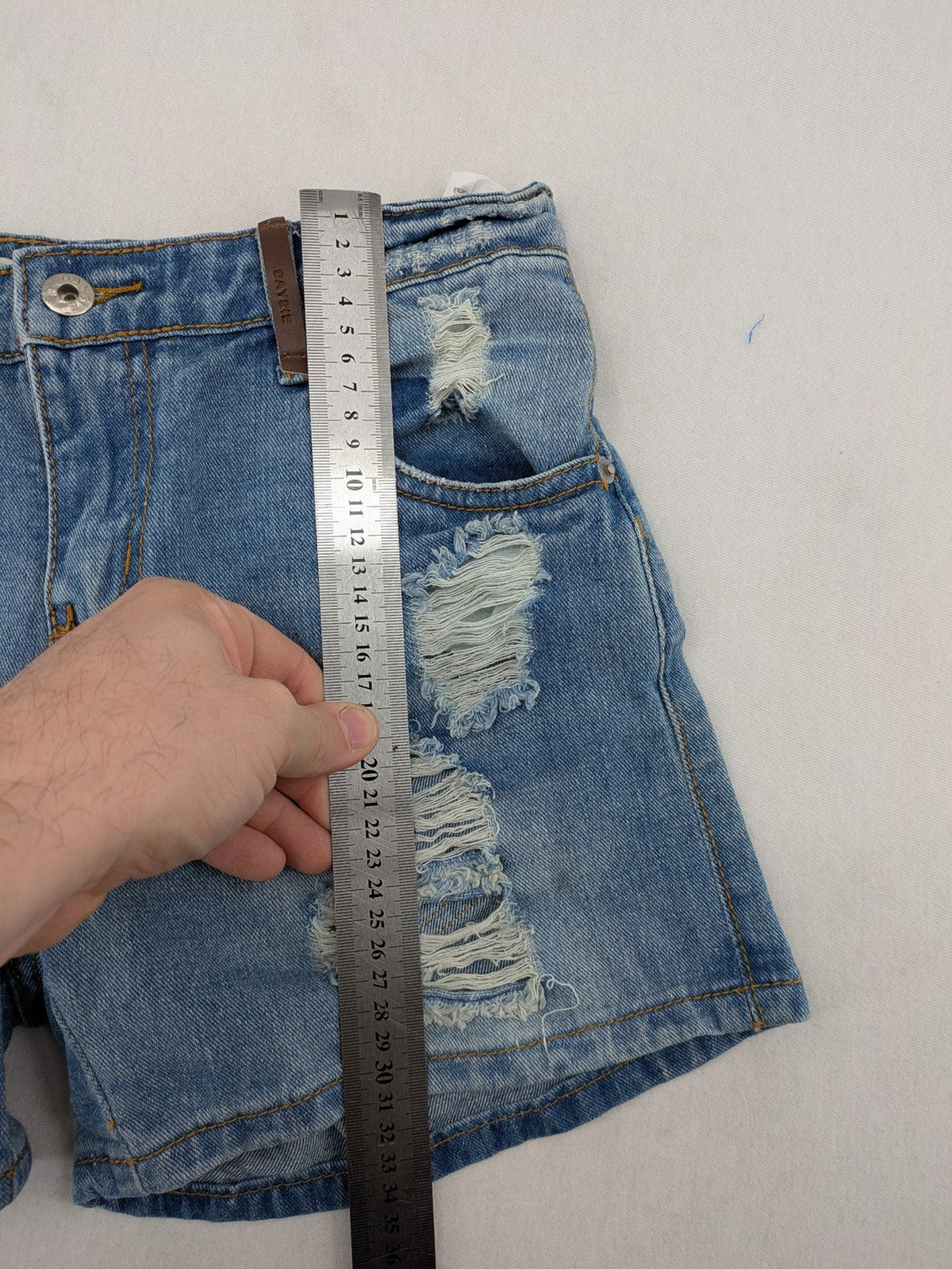 Daysie blue boyfriend jeans shorts with distressed rips and classic 5-pocket design.