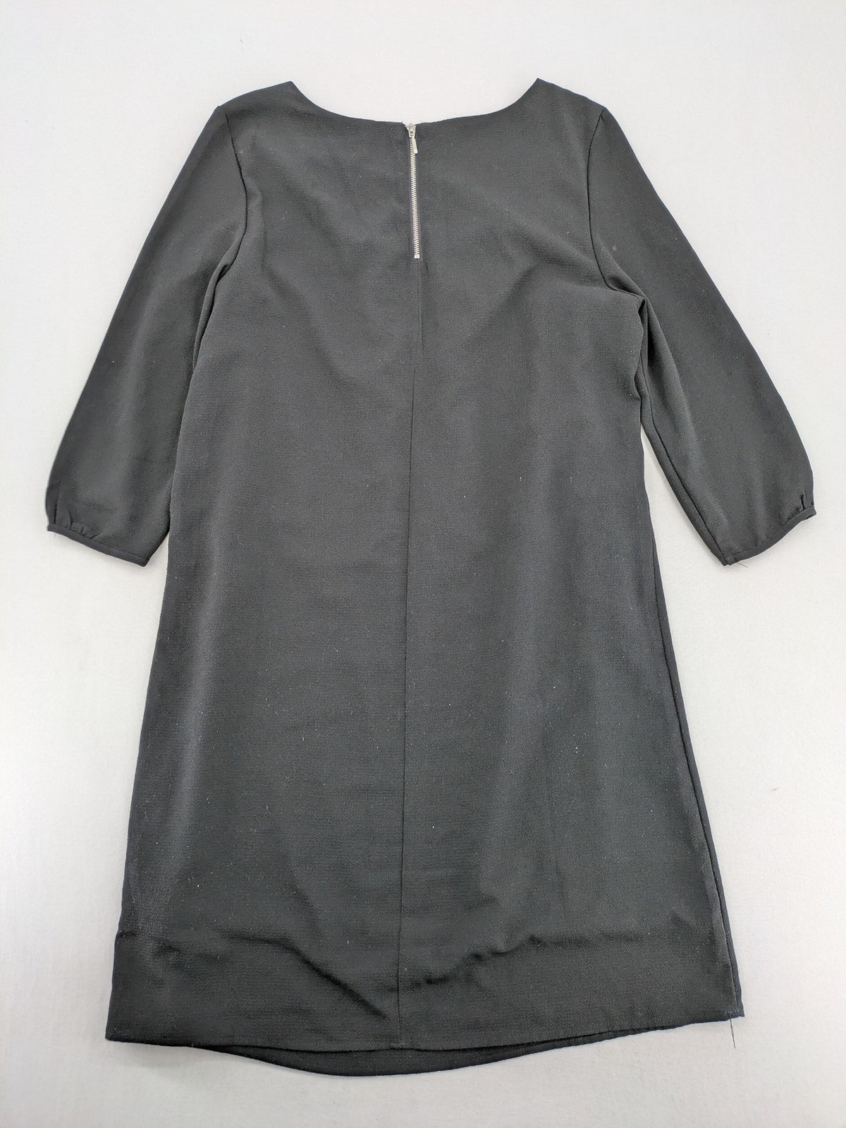 Infinity grey bridal party dress with pleated front and 3/4 sleeves.