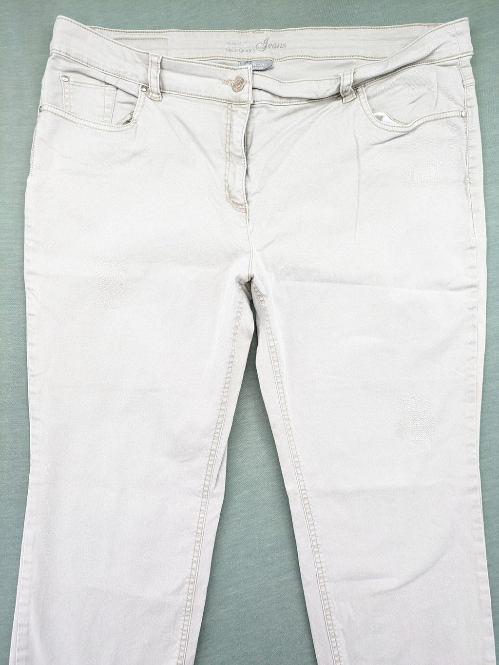 Canda beige straight jeans with strass details and classic five-pocket design.