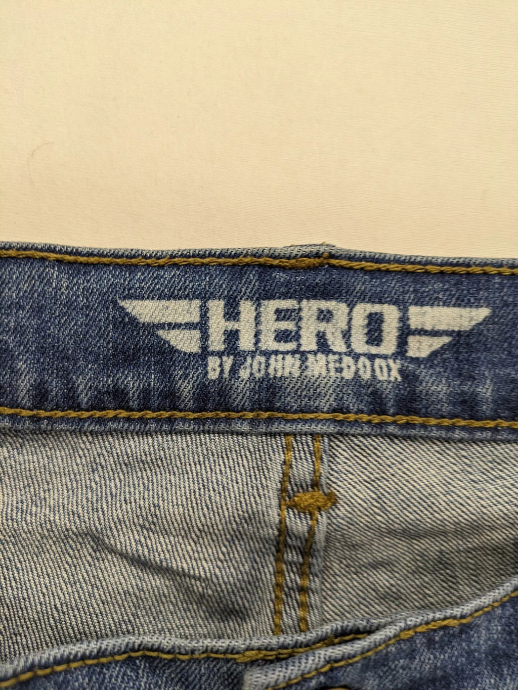 Hero By John Meddox blue straight jeans with five-pocket design and zip fly.