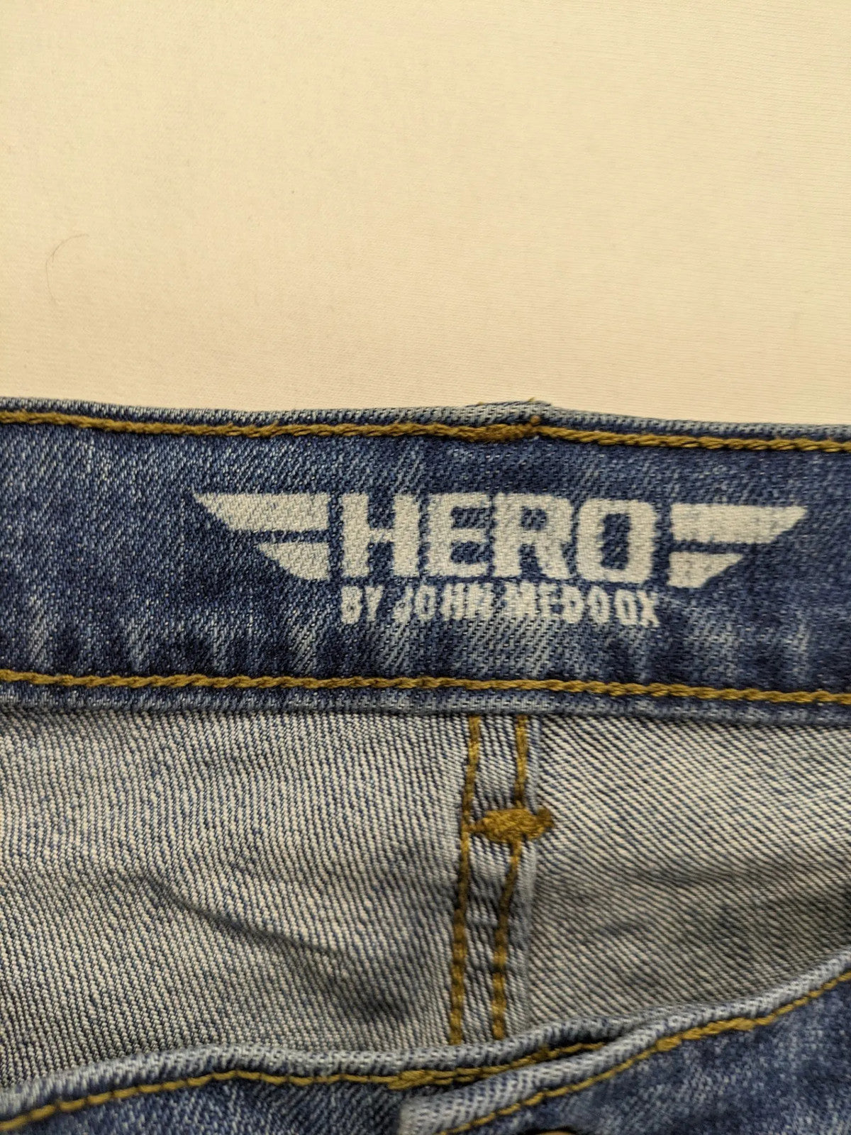 Hero By John Meddox blue straight jeans with five-pocket design and zip fly.