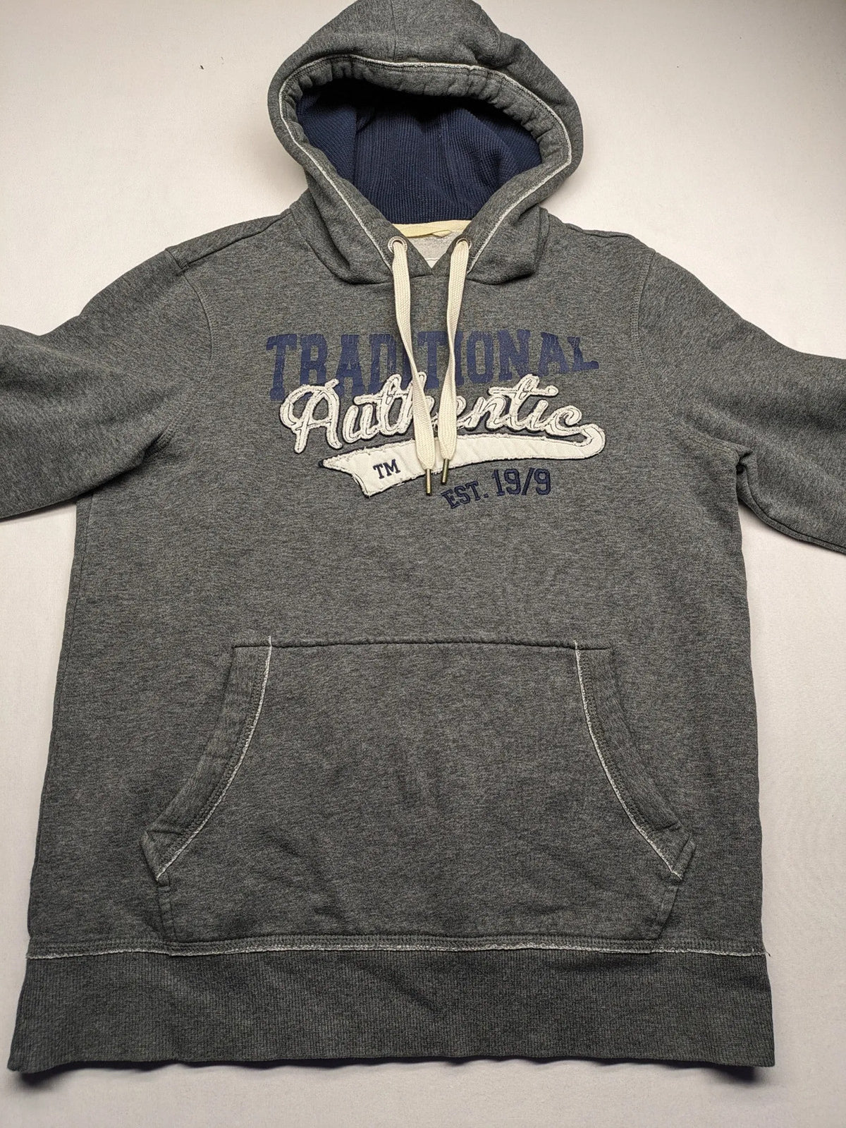 Livergy grey zip-through hoodie with "Traditional Authentic" graphic, kangaroo pocket, soft material.