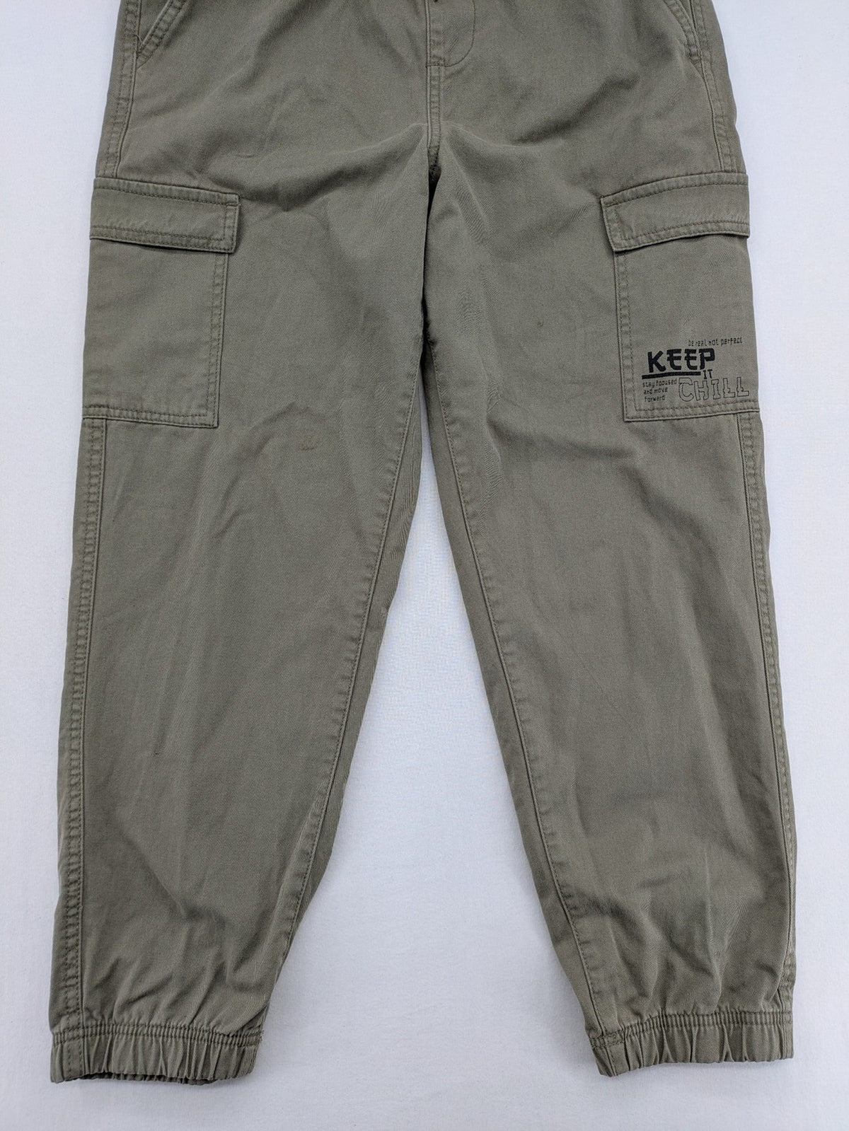 Y.F.K. khaki cargo pants with elastic cuffs, side pockets, and drawstring waistband.