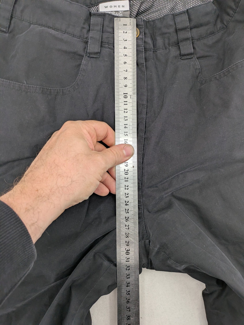 Jack Wolfskin grey outdoor pants with embroidered logo and side zip pocket.