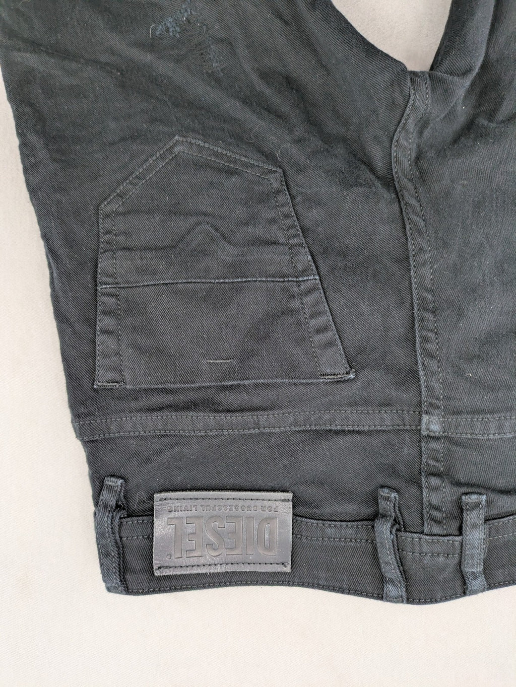 Diesel black Thommer Slim jeans with classic 5-pocket design and stretch material.