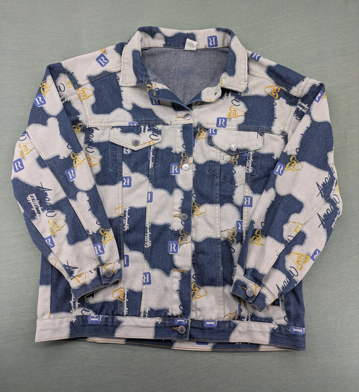 XXL blue and white graphic jacket with allover print and classic trucker style.