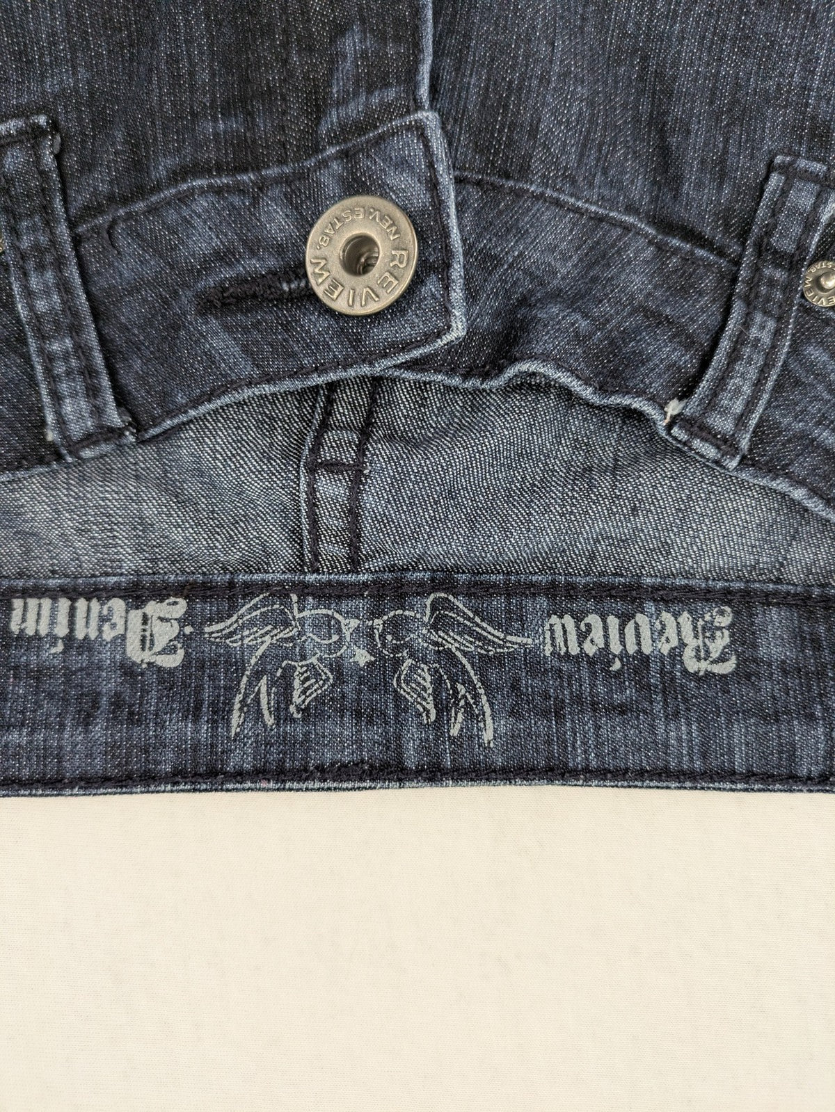 Review straight leg jeans dark blue low rise stretch denim with classic design.