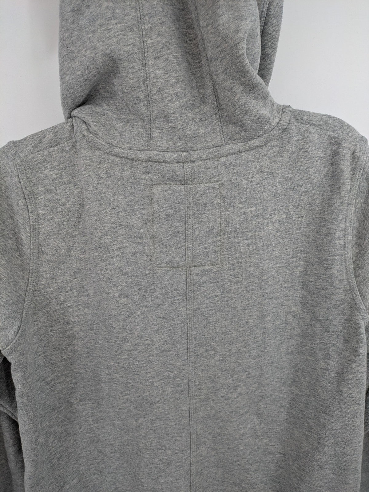 ESMARA cream jumpsuit with hood, graphic print, and front zipper, soft material.