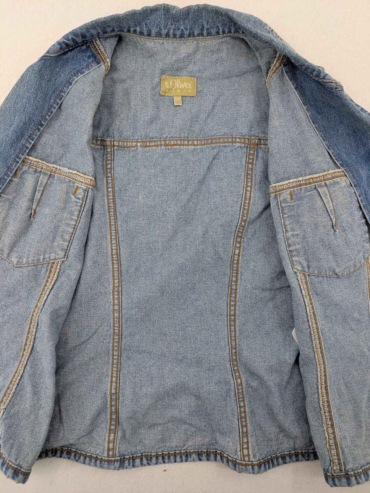 s.Oliver blue denim vest with button closure, pointed collar, and breast pockets.