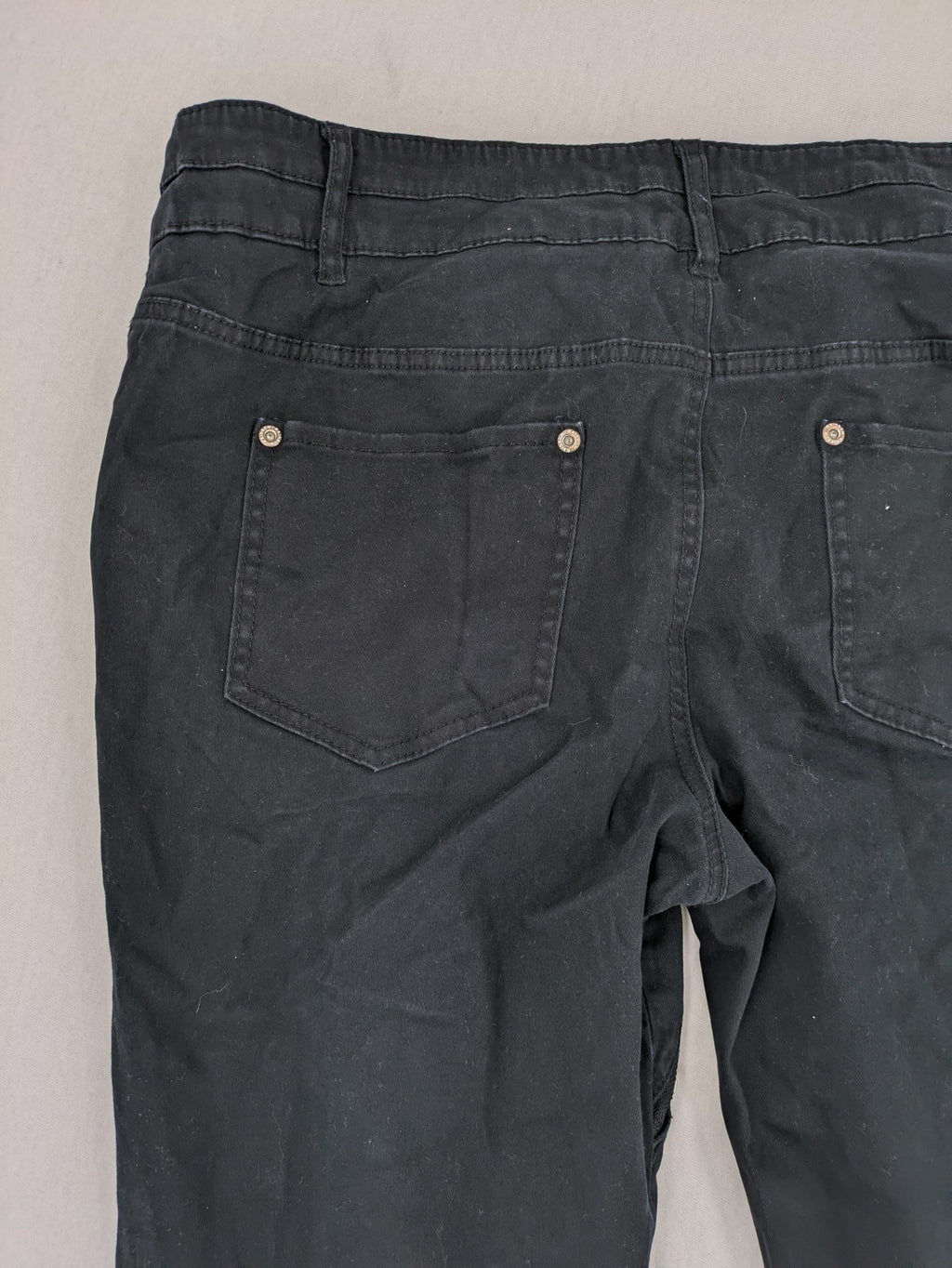 REI grey pants asymmetrical design with diagonal zipper and button placket, cotton blend.