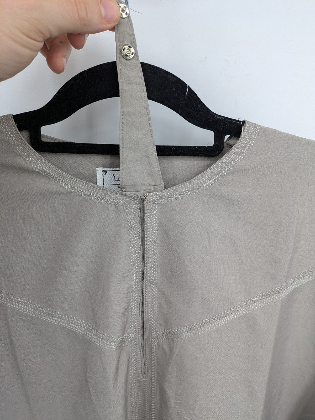 Aleasha beige kaftan thobe long sleeve with subtle embroidery and side pockets.
