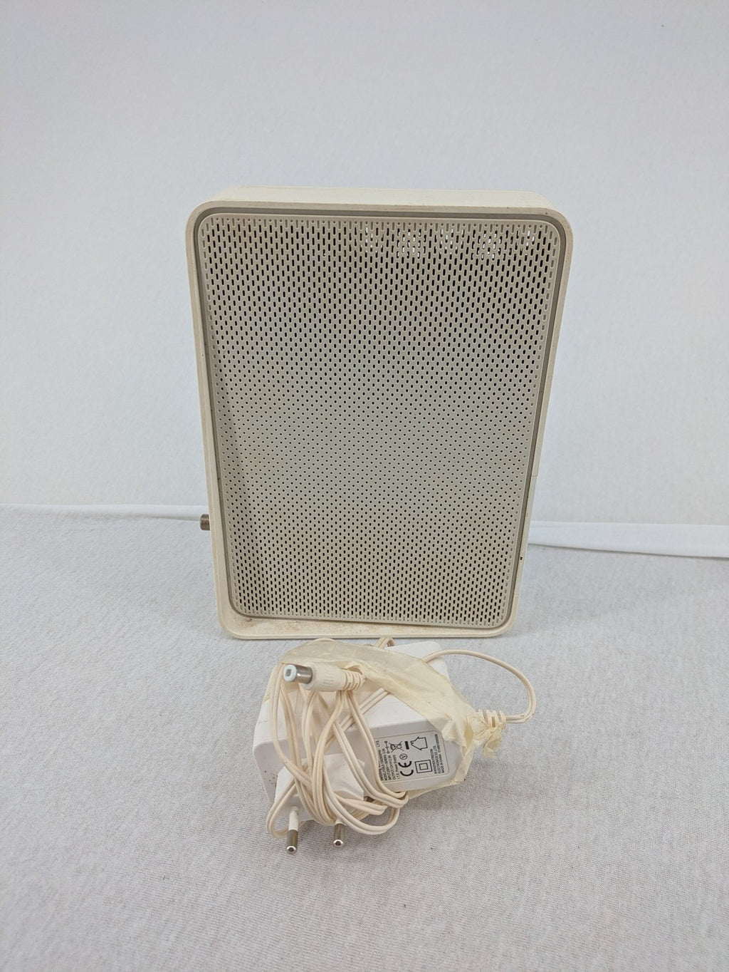 Compal beige WLAN modem router with integrated Wi-Fi and multiple LAN ports.
