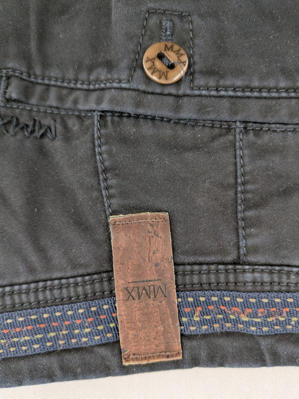 MMX grey chino pants with colorful inner waistband and premium bio-cotton blend.