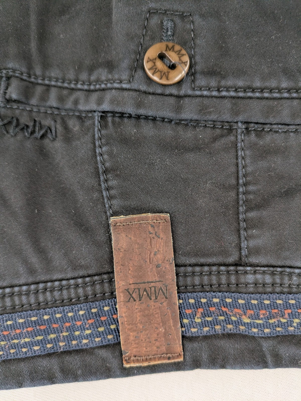 MMX grey chino pants with colorful inner waistband and premium bio-cotton blend.