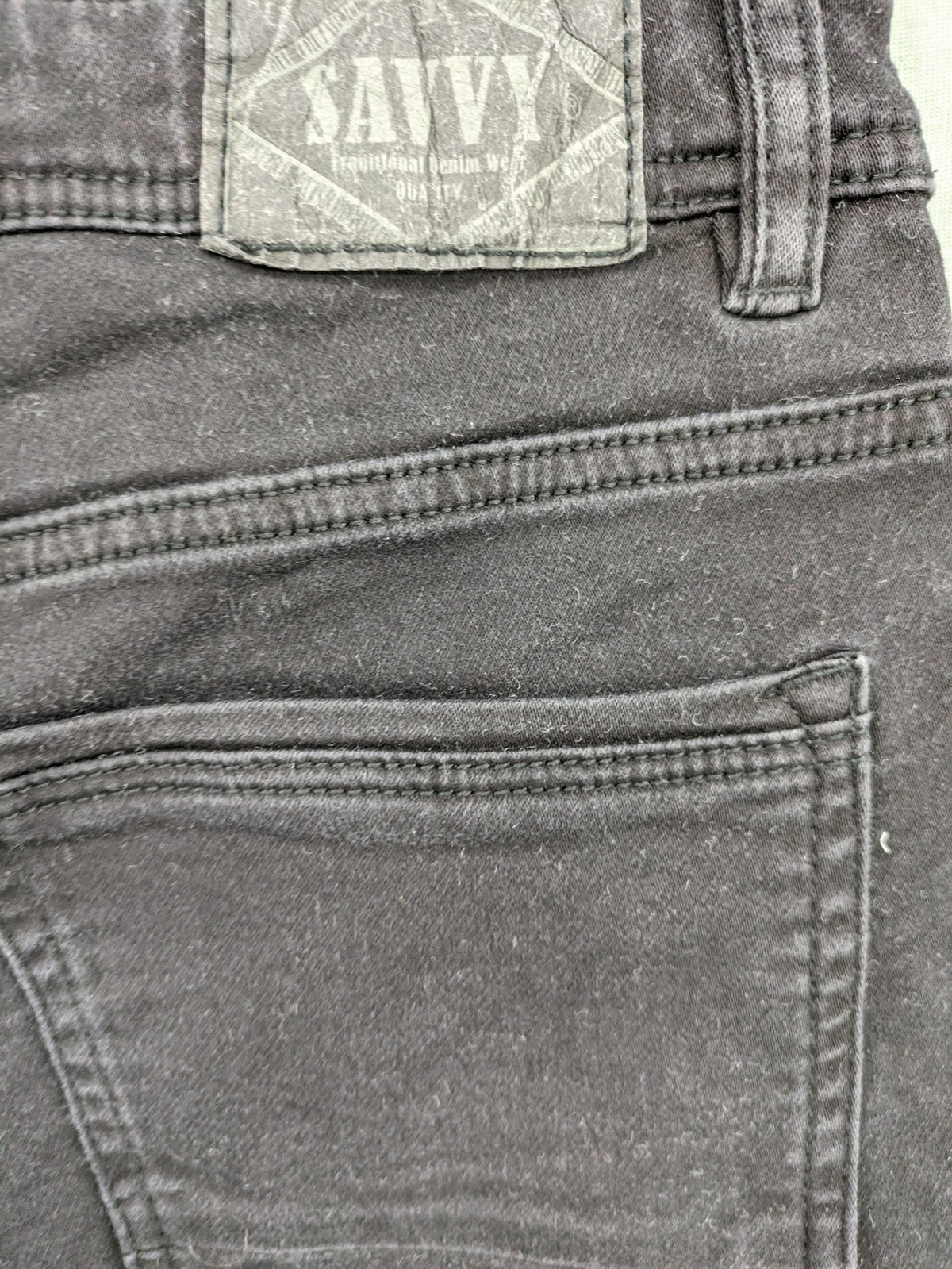 Savvy black straight jeans with washed finish and slim fit, made from stretch denim.