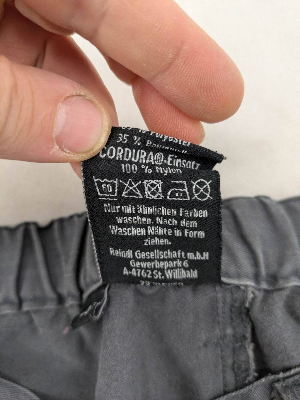 Watsons grey and black hunting tactical pants with Cordura reinforcements and elastic waistband.