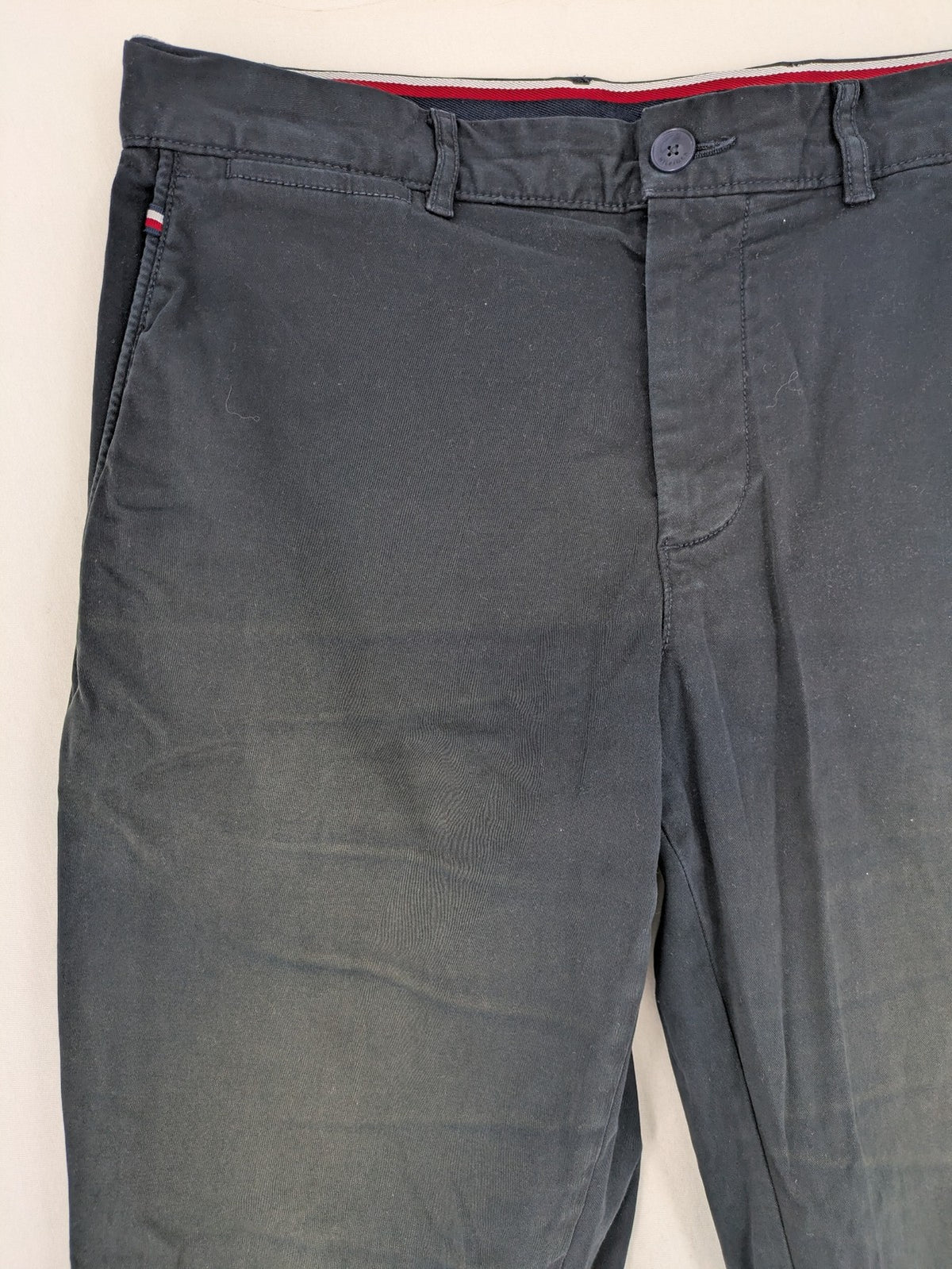 Tommy Hilfiger grey chino pants with TH-Flex stretch technology and classic straight fit design.