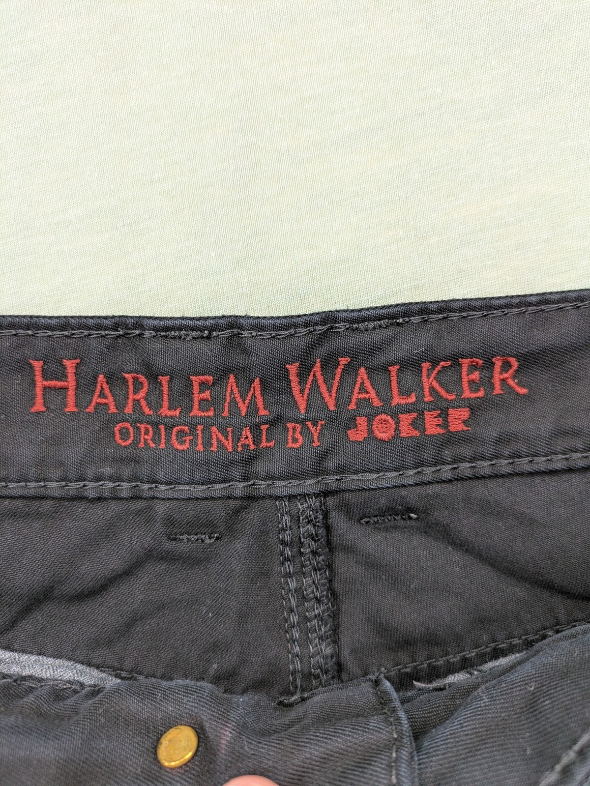 Joker black straight jeans five-pocket design with prominent stitching and brand details.