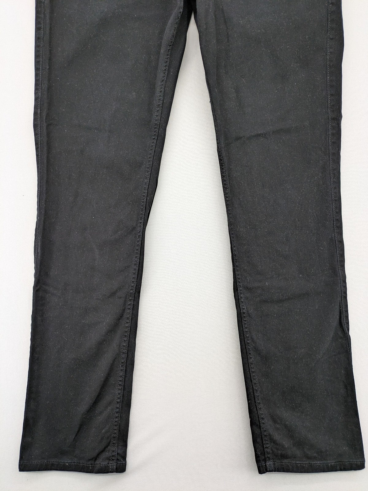 Jack & Jones black slim fit jeans with logo patch and cotton-stretch blend.