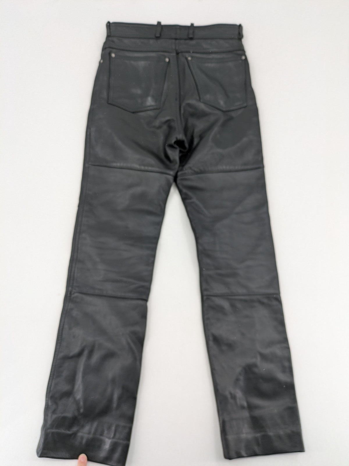 Hein Gericke black leather chaps with studs and wavy decorative seams.