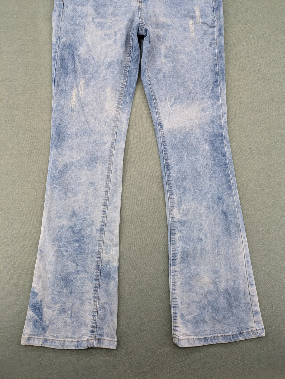 Arizona blue flare jeans with acid wash, button fly, and stretch denim material.
