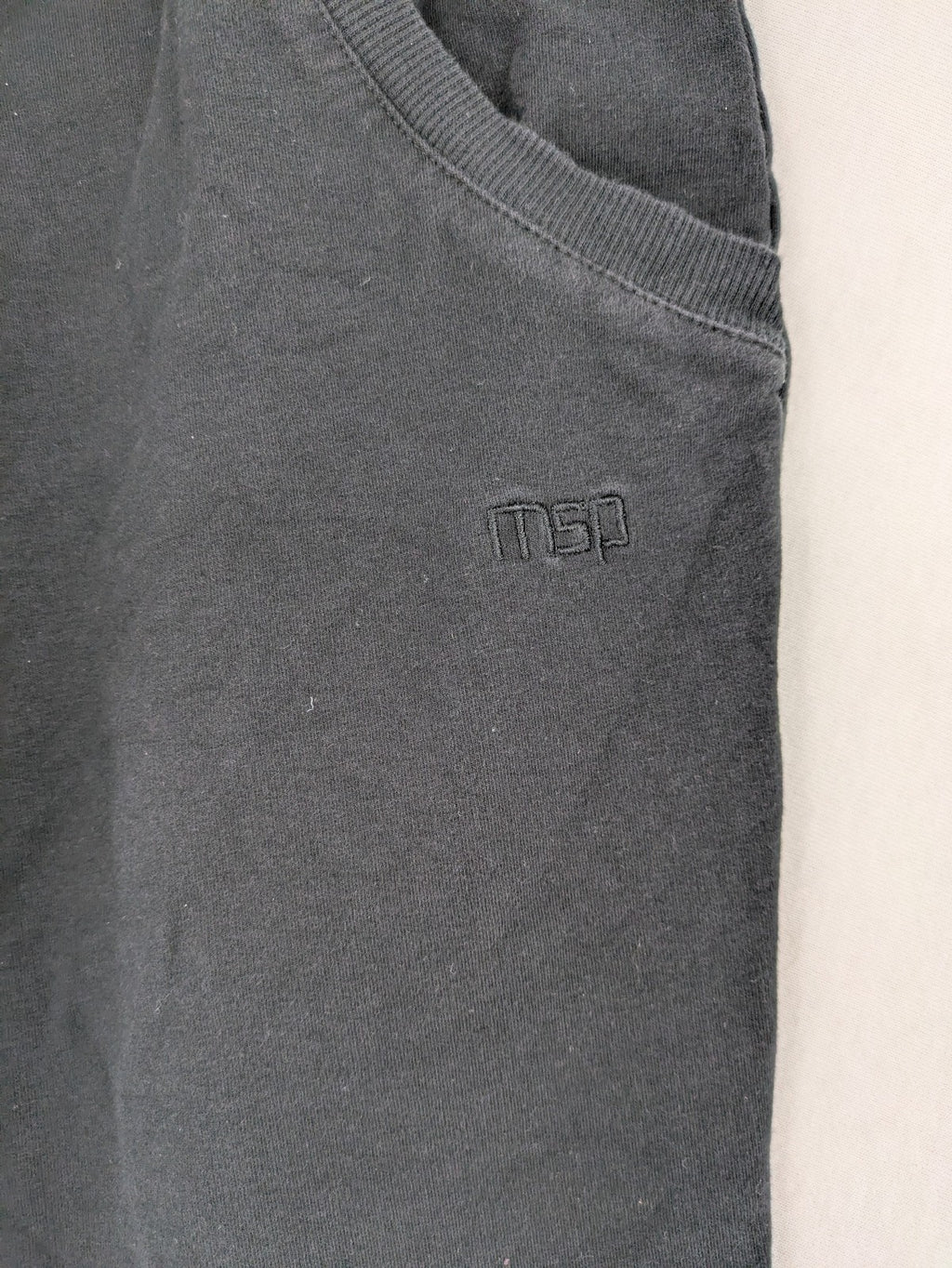 Manguun Sports grey jogger pants soft cotton blend with subtle logo embroidery and elastic waistband.