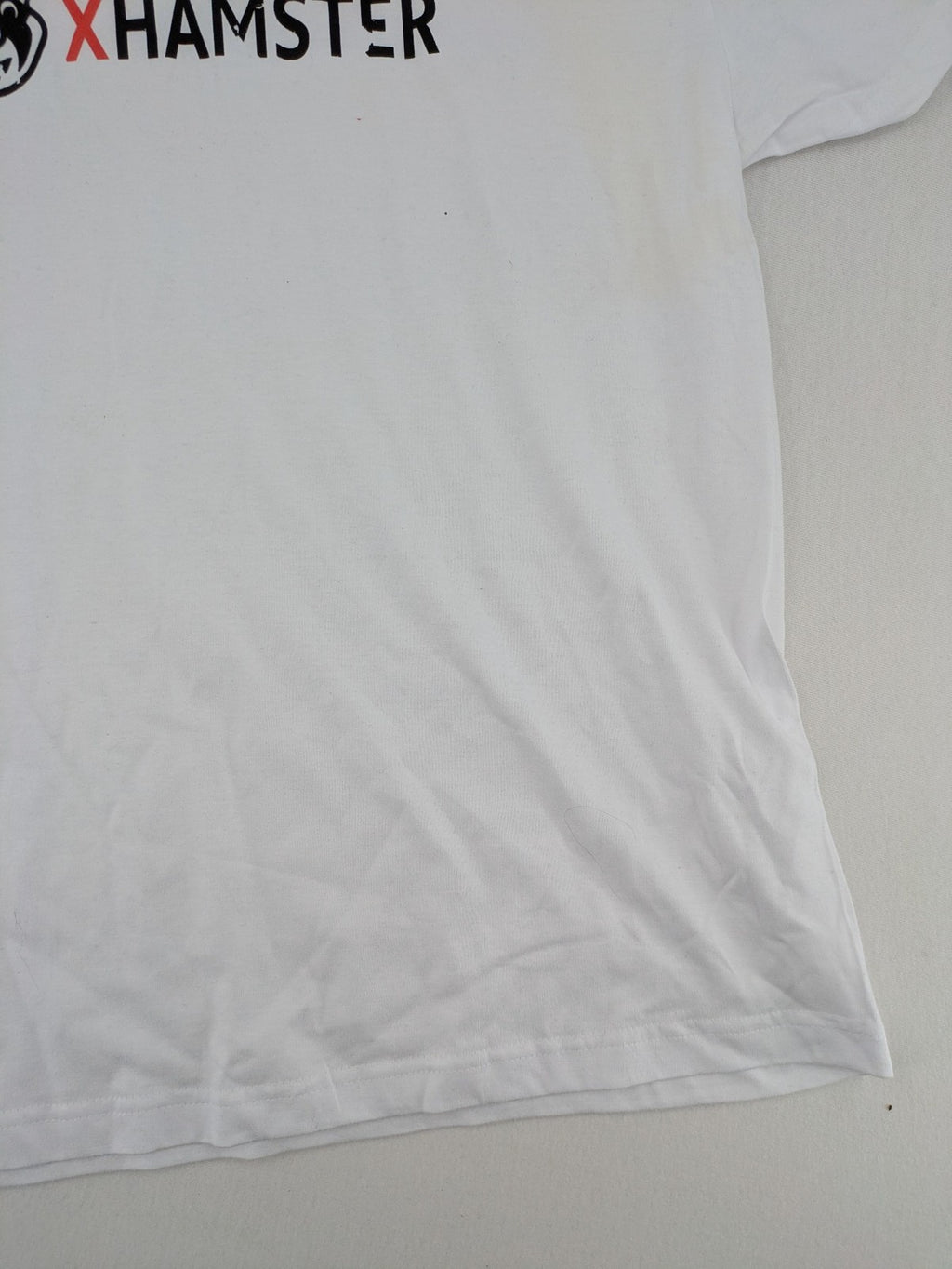 Xhamster white graphic t-shirt printed logo on chest, short sleeves, round neck.