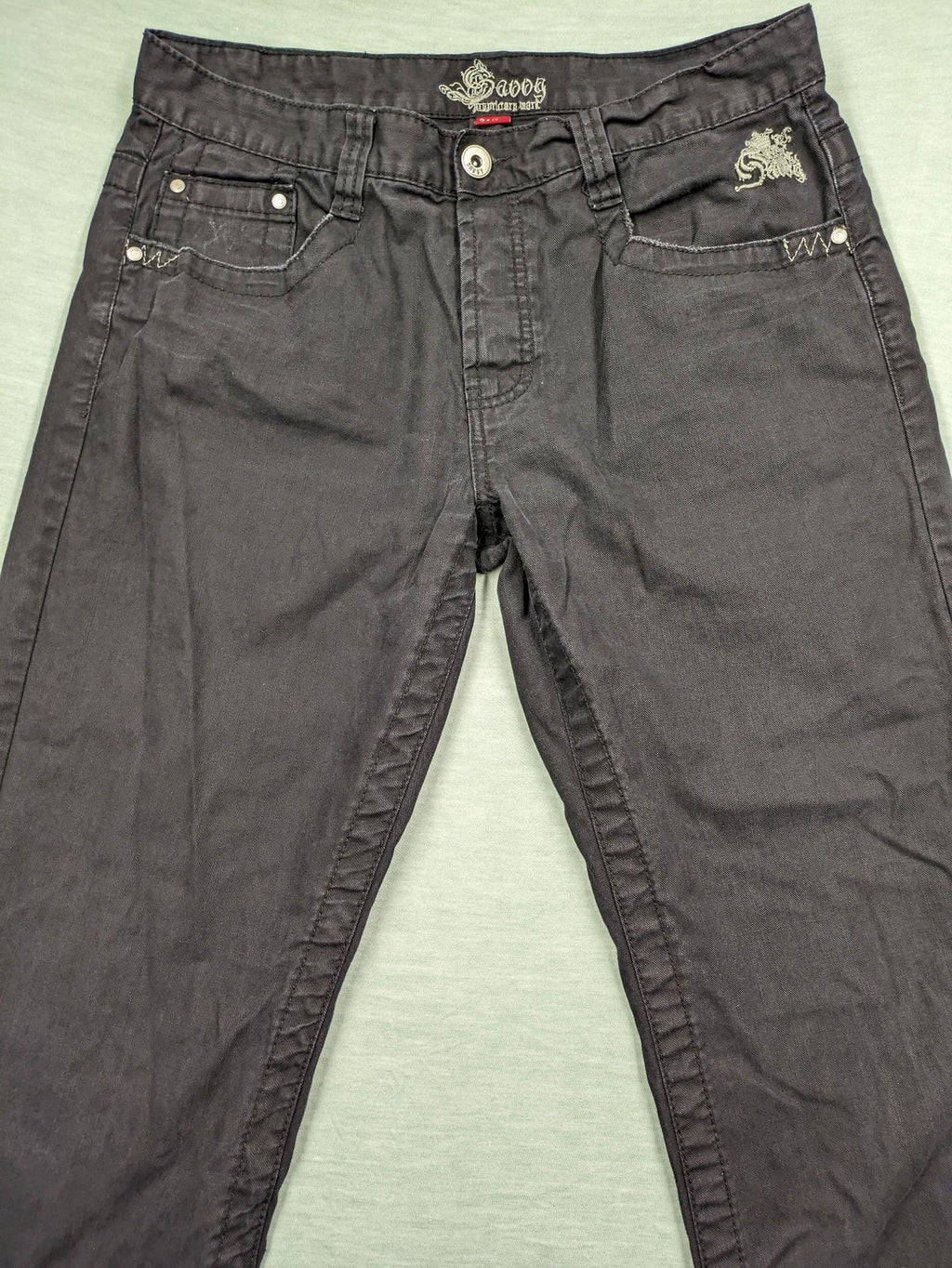 Savvy black pants straight fit with button fly, embroidered details and unique stitching.
