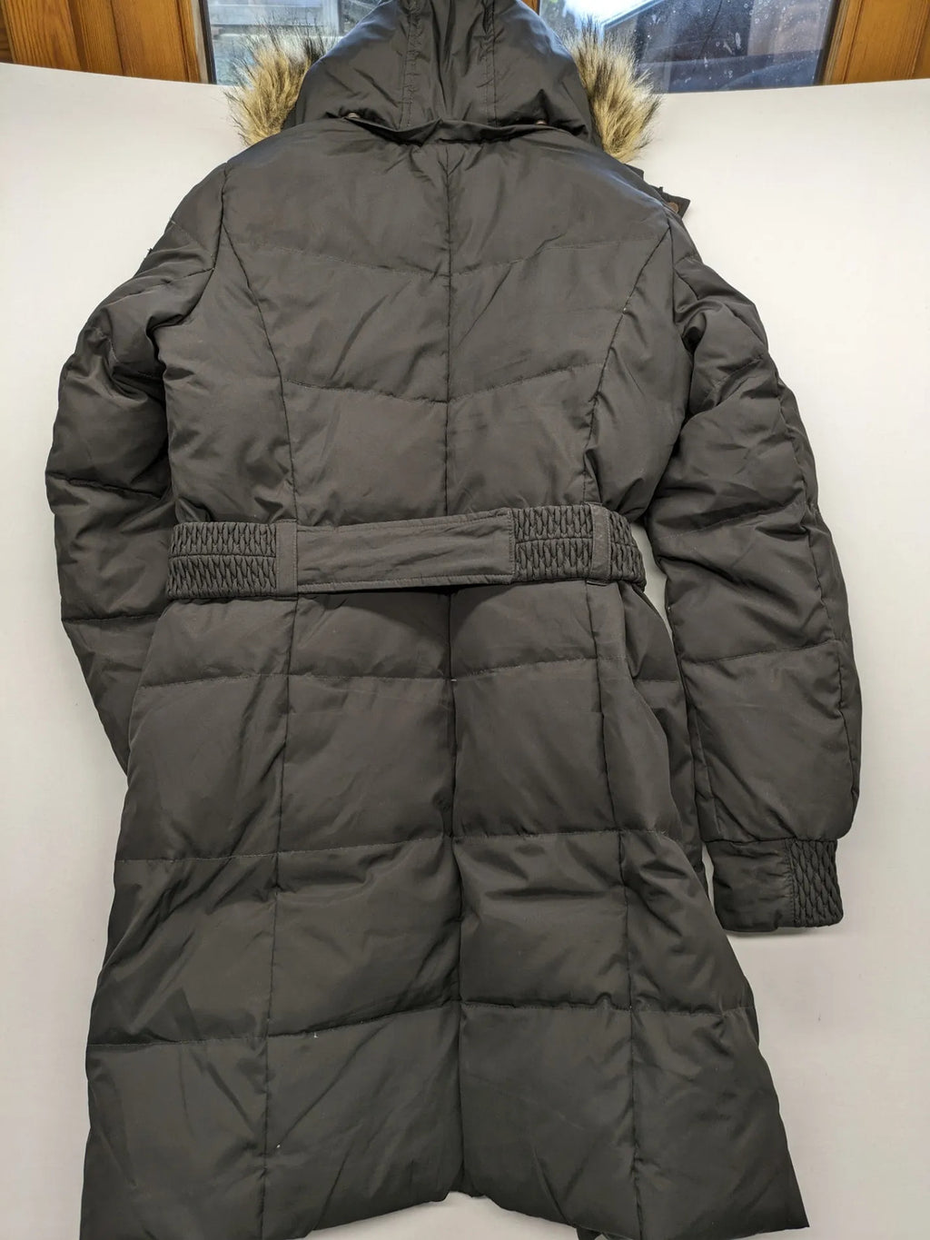 Esprit black quilted coat with removable faux fur hood and elastic waist belt.