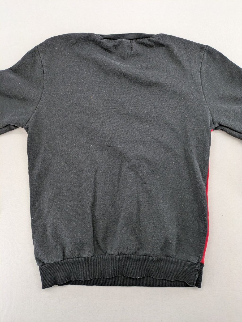 Boystar vintage turtle neck jumper red black colorblock with "MUST FREE YOUR BODY" graphic.