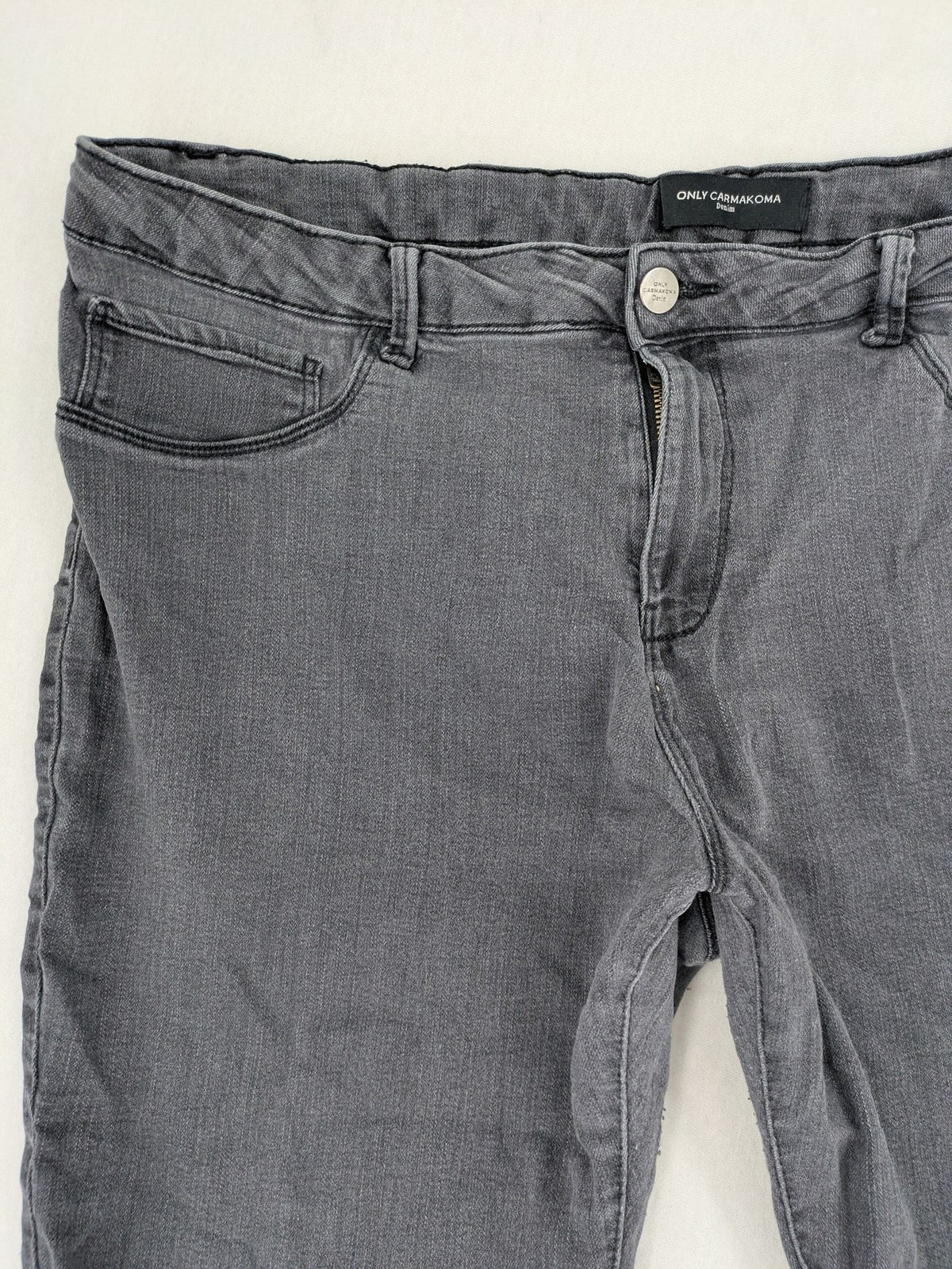ONLY Carmakoma grey skinny fit jeans with subtle washed look and stretch denim material.
