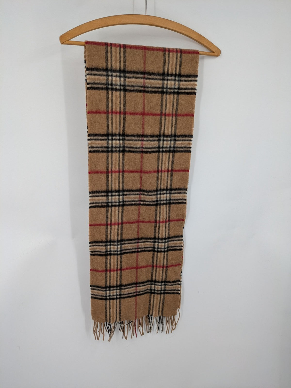 Karo unisex scarf camel brown tartan pattern 100% cashmere with black, white, and red accents.