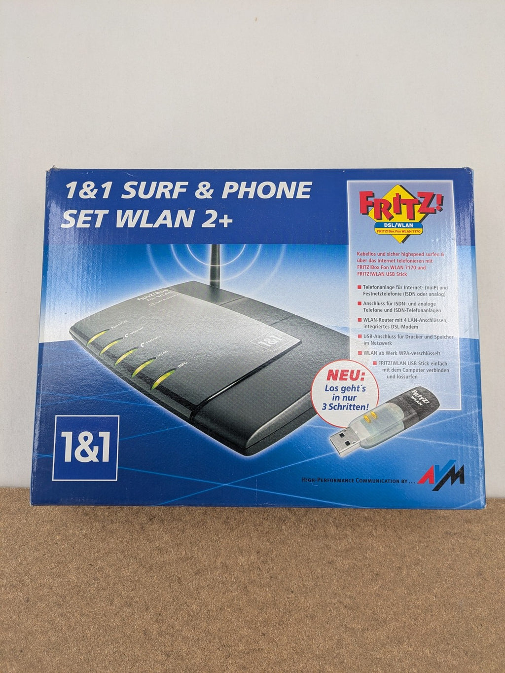 AVM VoIP gateway router blue with integrated DSL modem and phone system features.