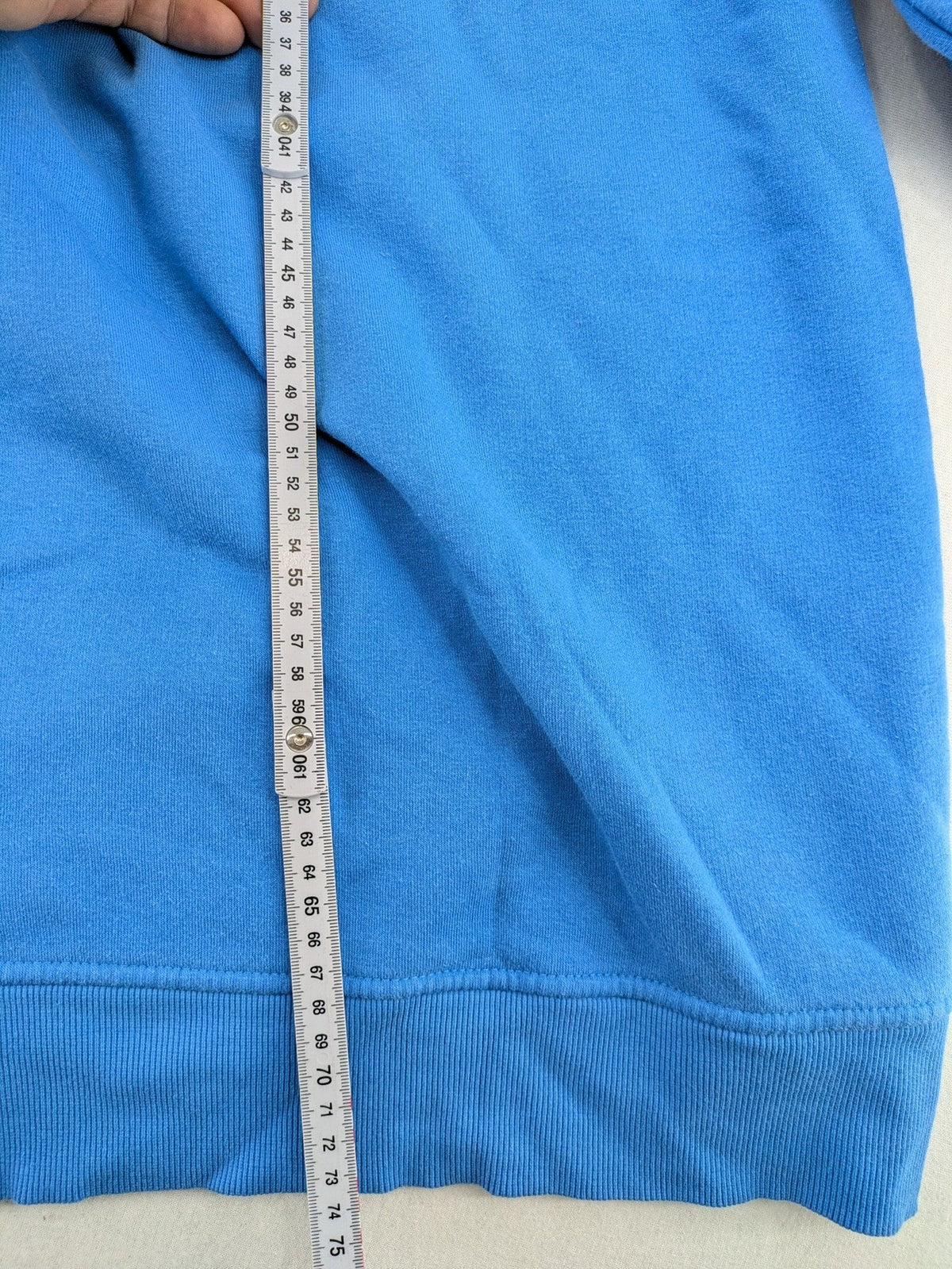 Masters of the Universe blue zip-through hoodie featuring large He-Man logo and drawstring hood.