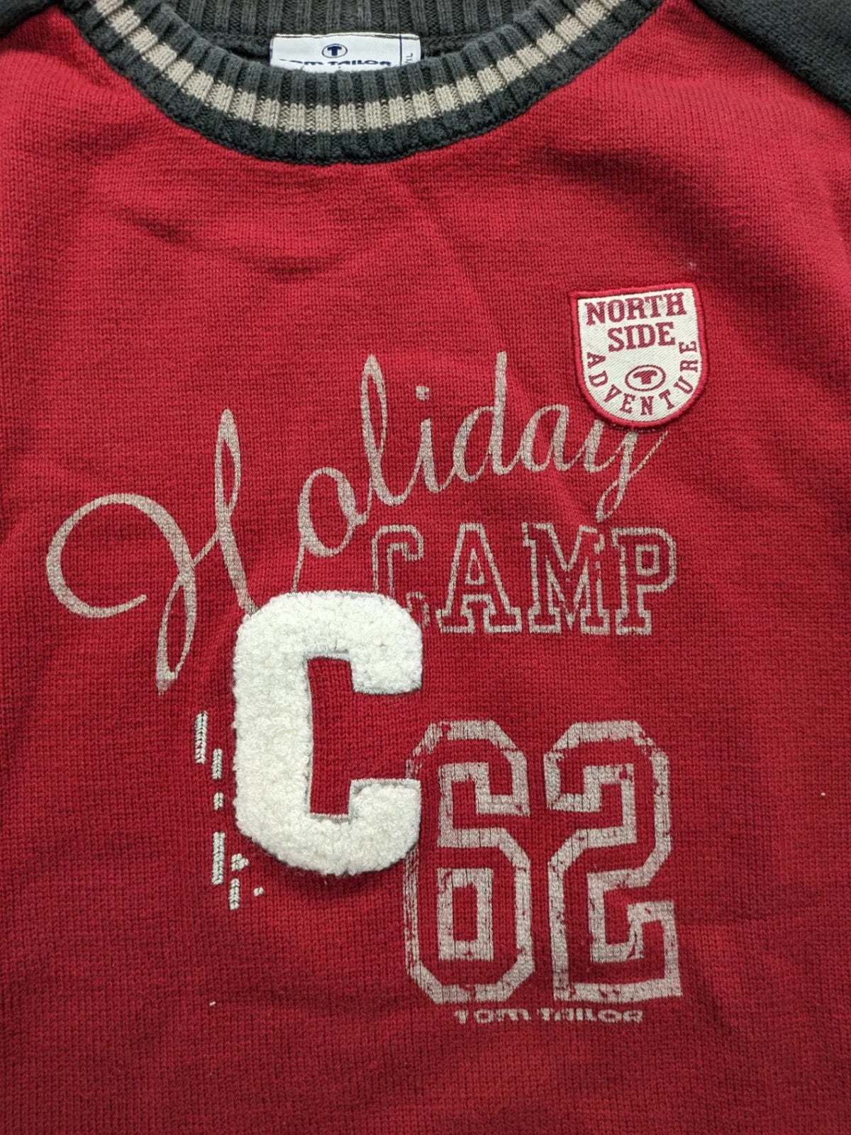 Tom Tailor black and red turtle neck jumper with "Holiday Camp" chenille patch and striped cuffs.