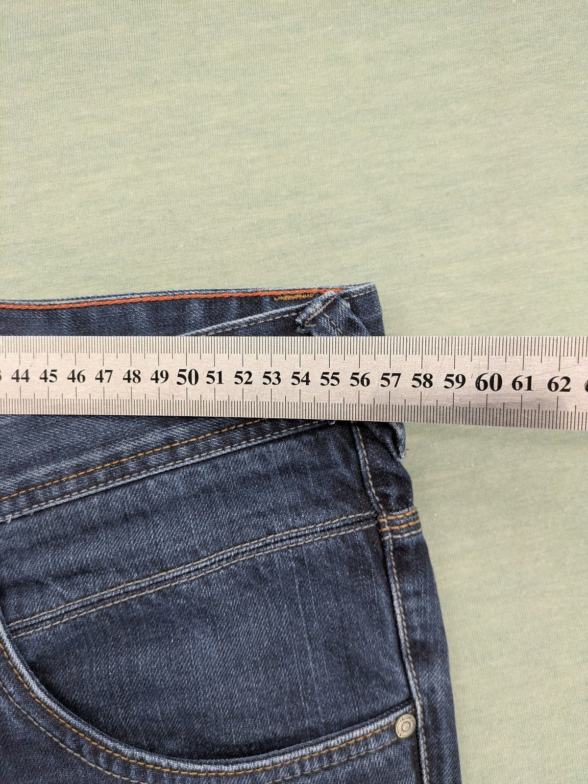 Canda blue straight jeans with five-pocket design and dark wash denim.