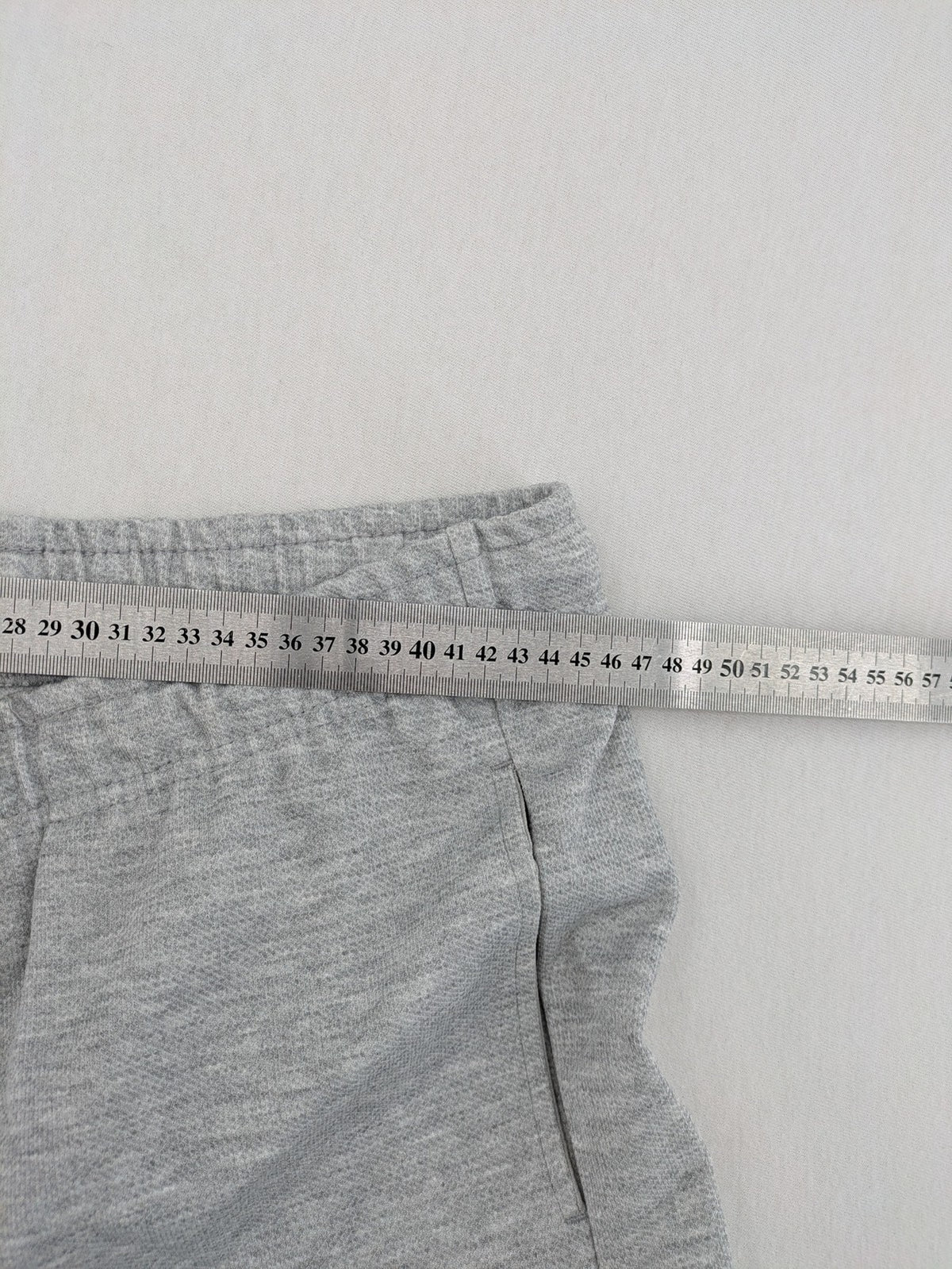 C&A grey sweatpants with elastic waistband, adjustable drawstring, and side pockets.
