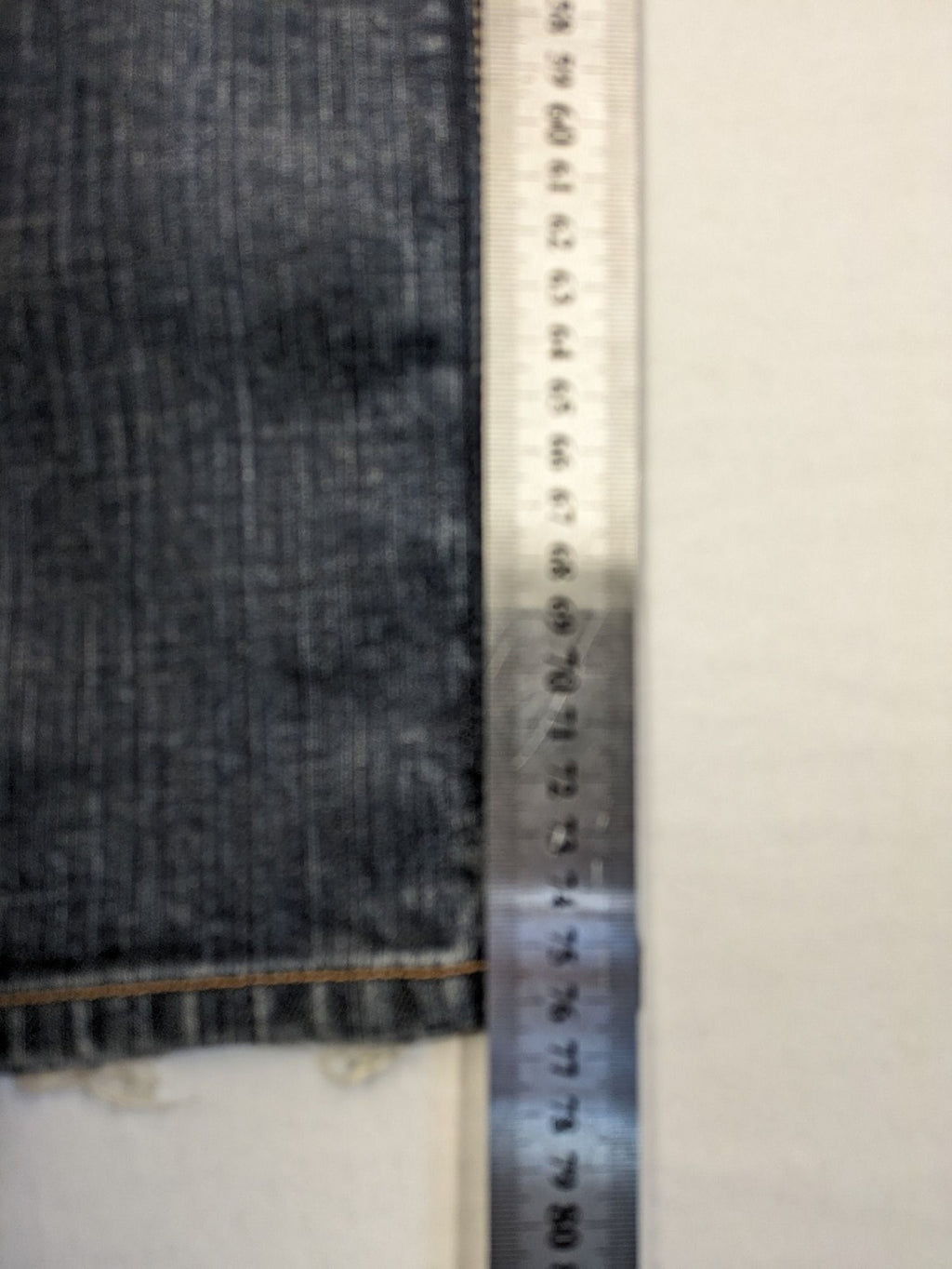 Tommy Hilfiger Denim blue straight jeans with low rise and slight used effects.