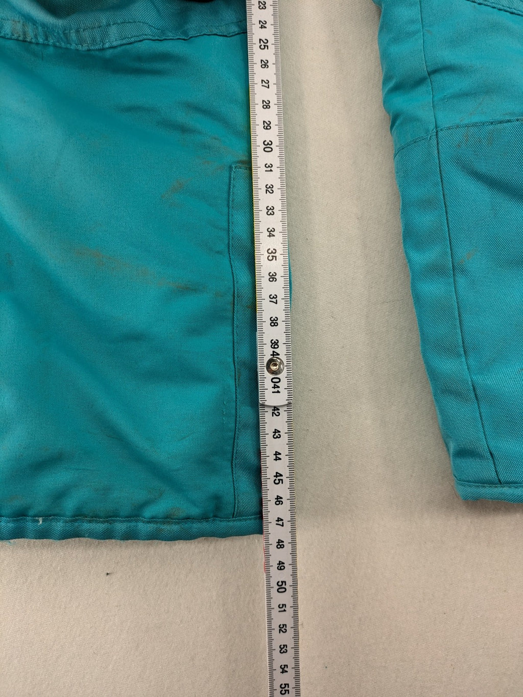 Topolino blue and turquoise snow pants with adjustable straps and fleece-lined bib.