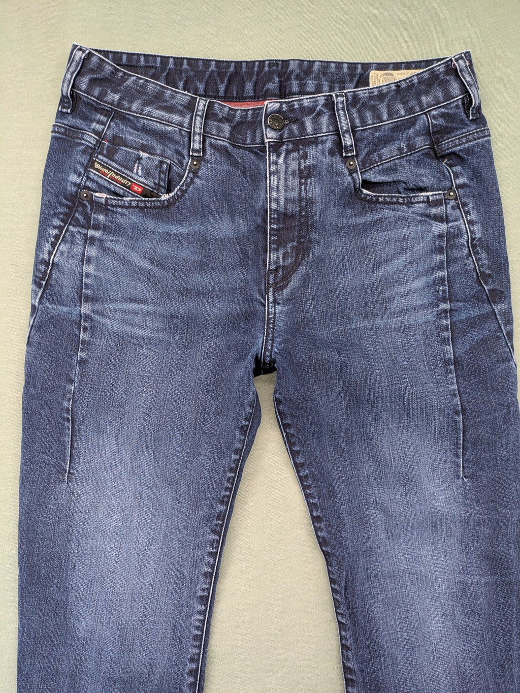Diesel blue boyfriend jeans low waist dark wash stretch denim with logo patch.