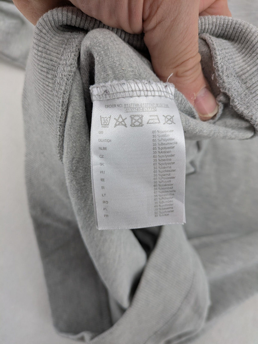 Colours Of The World grey knit jumper with pink drawstring, inspirational graphic print, soft material.