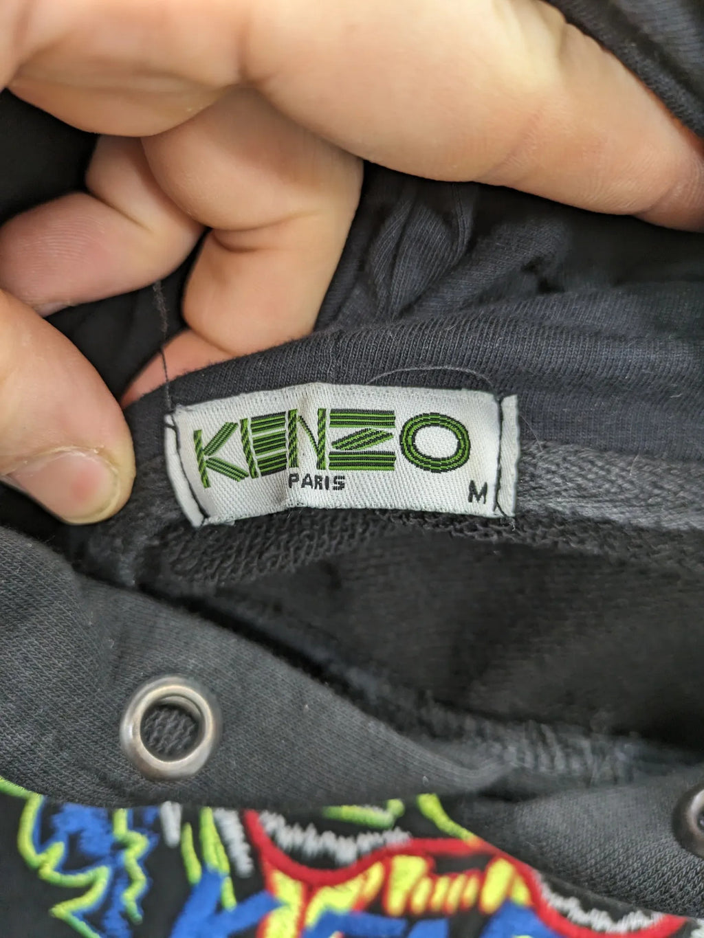 Kenzo multi hoodie with embroidered tiger graphic, drawstring hood, and kangaroo pocket.
