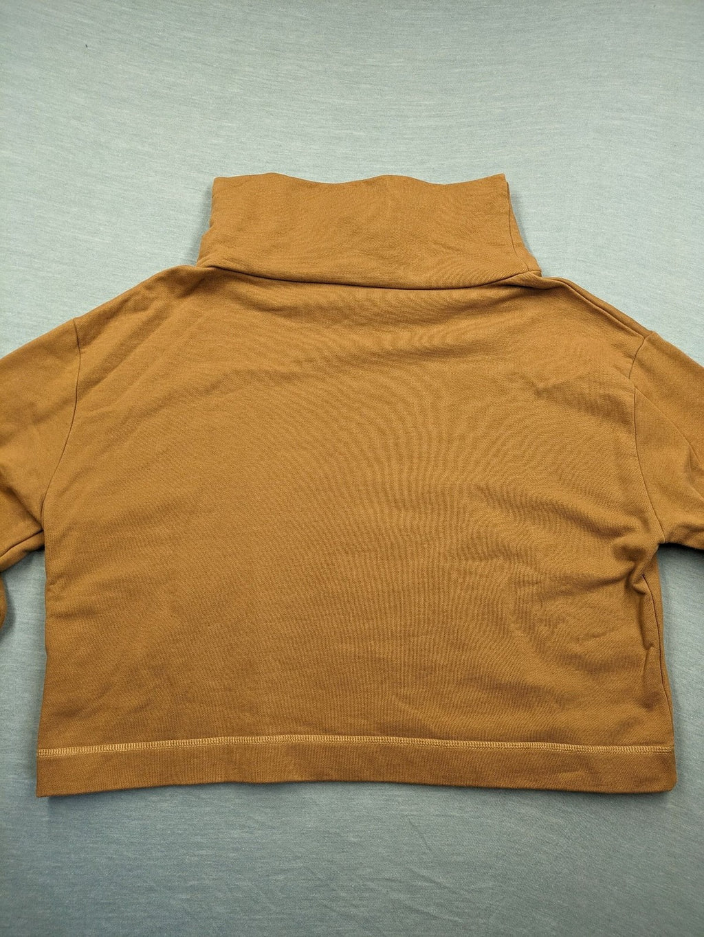 ALS orange crop top sweatshirt with roll neck and embroidered Lichtblick logo.