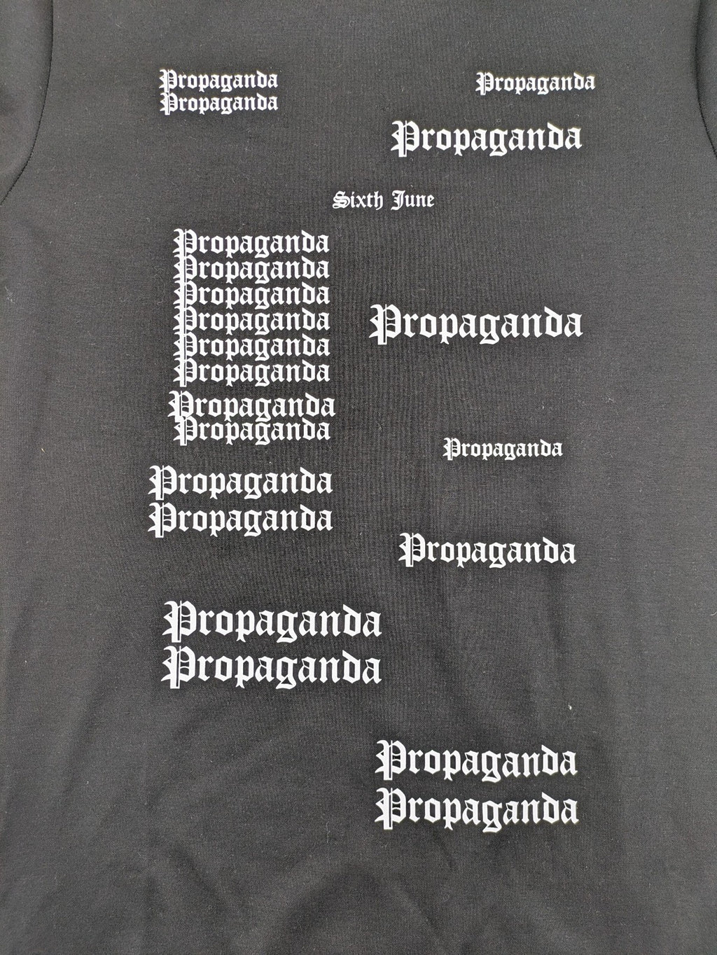 Sixth June black sweatshirt with Gothic "Propaganda" graphic print and logo details.