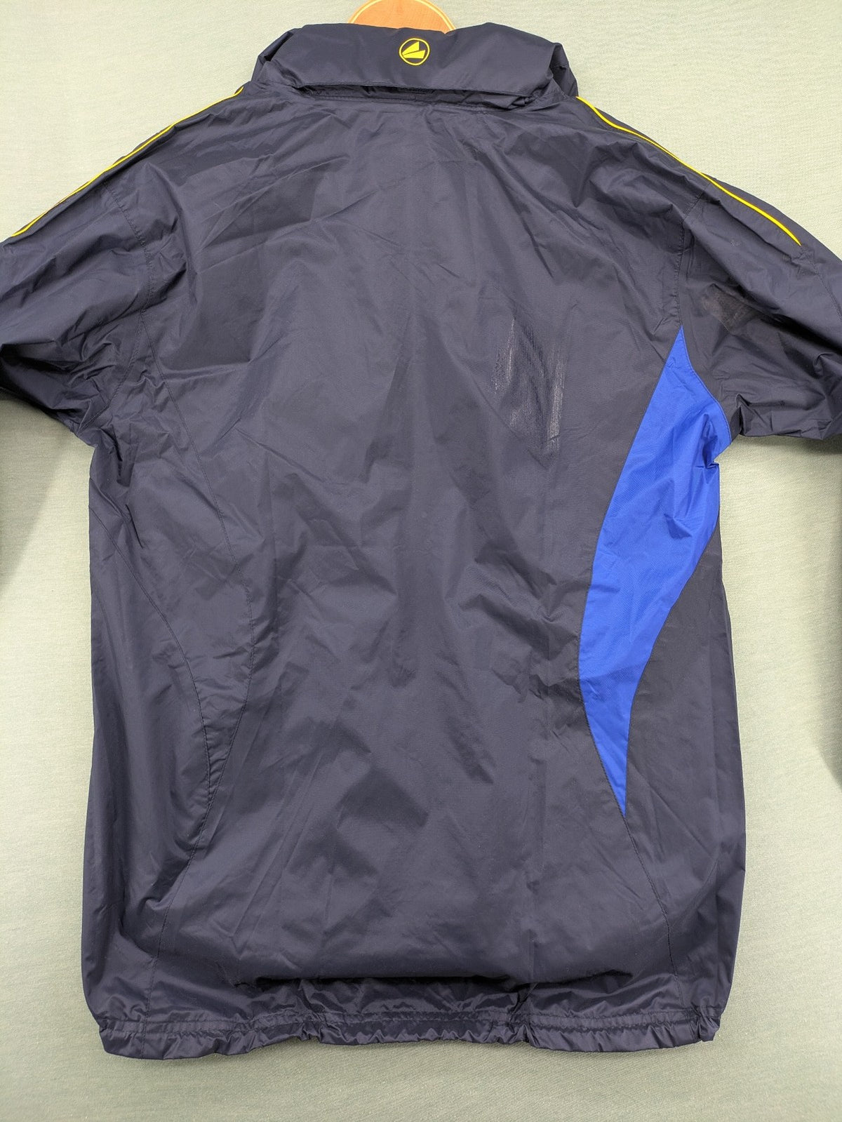 Jako navy windbreaker full zip jacket with breathable mesh lining and logo details.