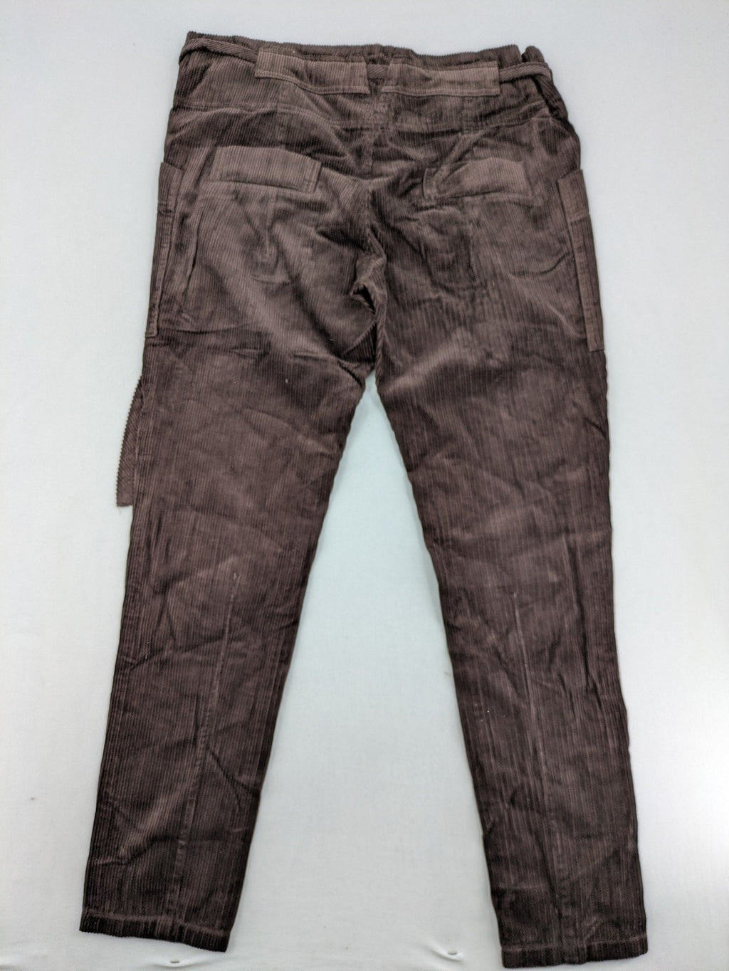 Alma & Lovis brown cord pants with elastic waistband, drawstring, and front patch pockets.