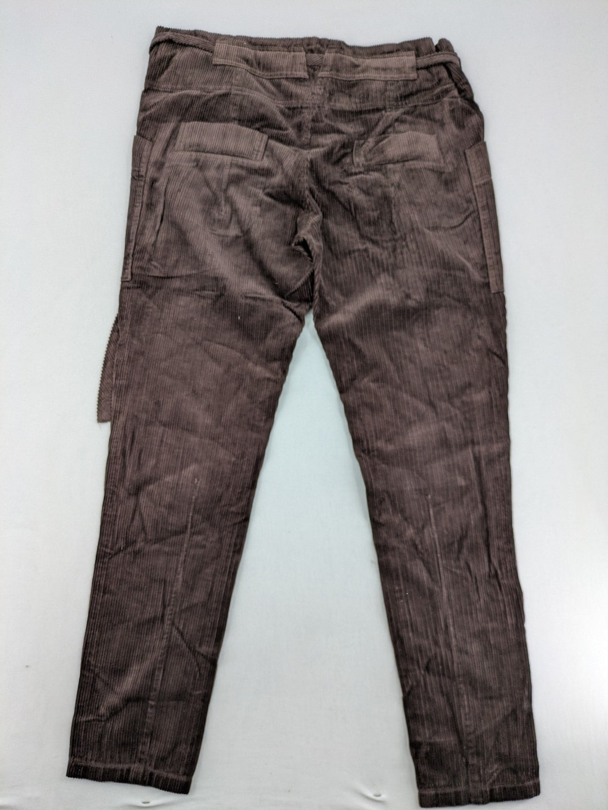Alma & Lovis brown cord pants with elastic waistband, drawstring, and front patch pockets.