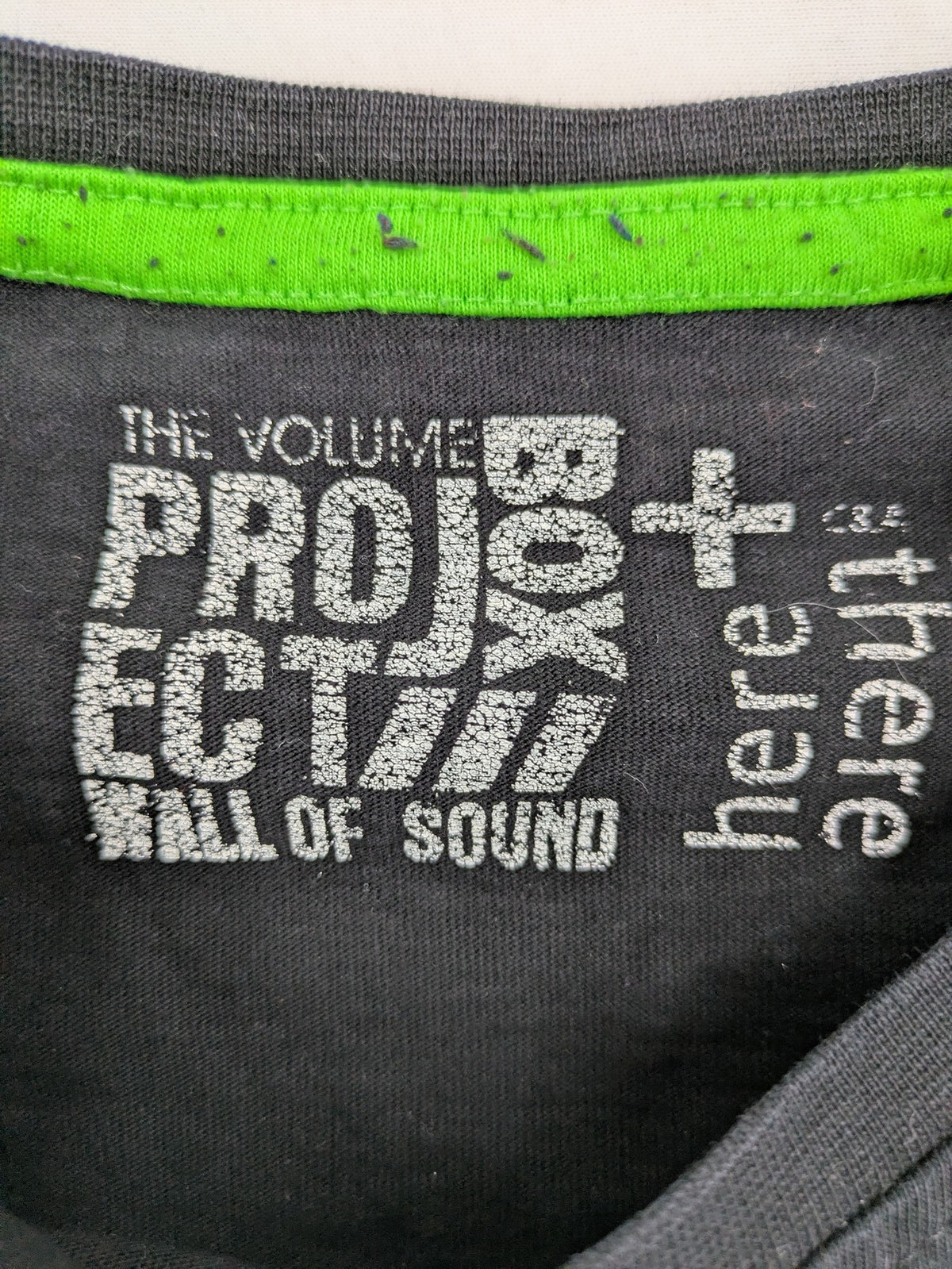 here there pink long sleeve shirt neon skull graphic with headphones and green contrast stitching