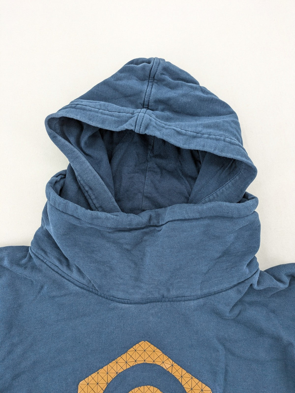 Jack & Jones Core blue hoodie with large gold "C" graphic and high collar.